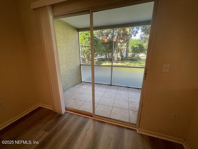 10075 Gate Parkway North, Unit 604 Jacksonville, FL 32246 - Photo 20 of 35 an empty room with wooden floor and windows