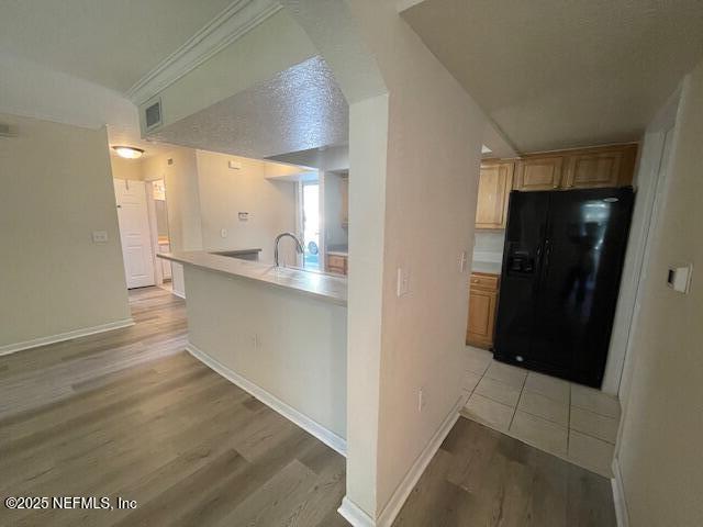 10075 Gate Parkway North, Unit 604 Jacksonville, FL 32246 - Photo 21 of 35 a view of a hallway to an empty room with wooden floor and a cabinet