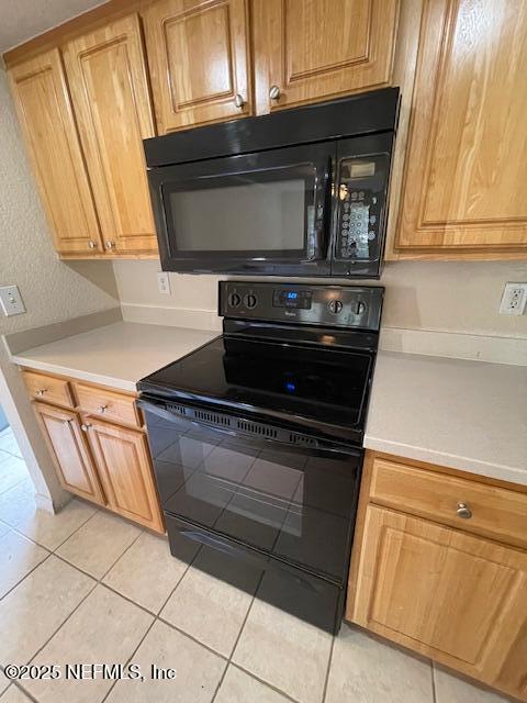 10075 Gate Parkway North, Unit 604 Jacksonville, FL 32246 - Photo 24 of 35 a stove top oven sitting inside of a kitchen