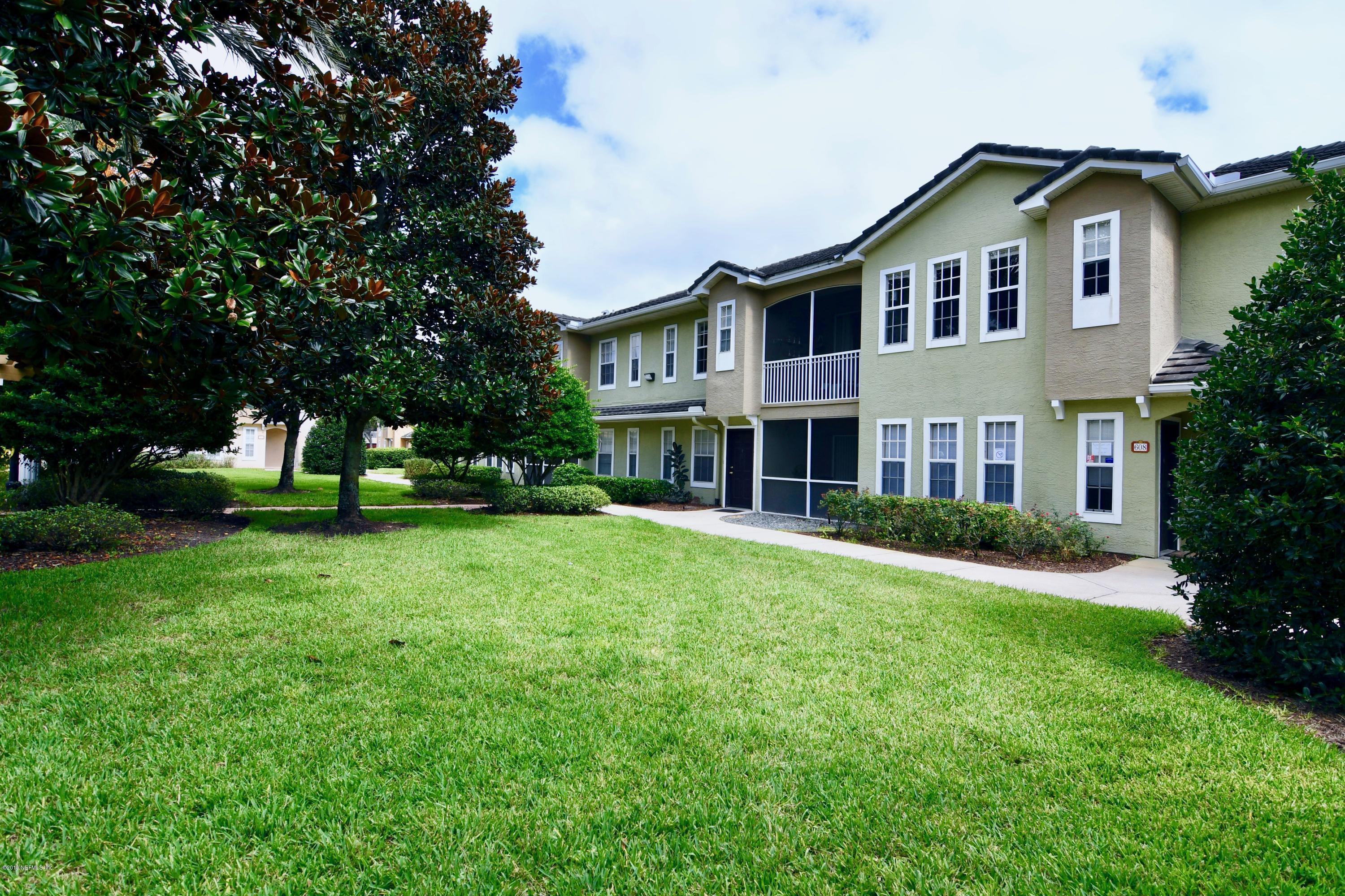10075 Gate Parkway North, Unit 604 Jacksonville, FL 32246 - Photo 31 of 35 a front view of a house with a yard