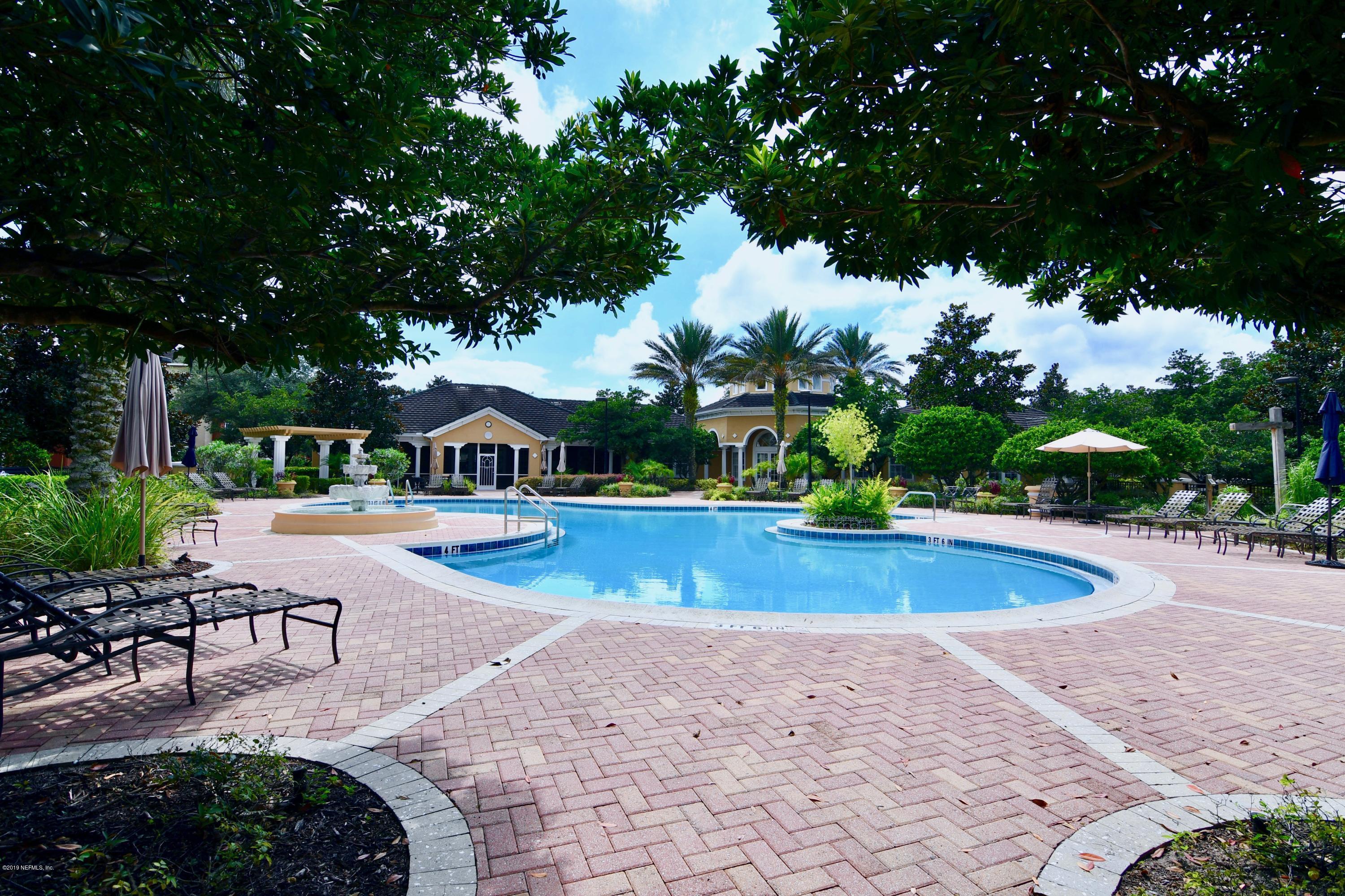 10075 Gate Parkway North, Unit 604 Jacksonville, FL 32246 - Photo 35 of 35 a view of swimming pool with lawn chairs and plants