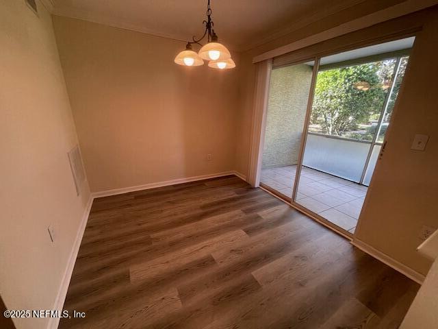10075 Gate Parkway North, Unit 604 Jacksonville, FL 32246 - Photo 5 of 35 wooden floor in an empty room with a window