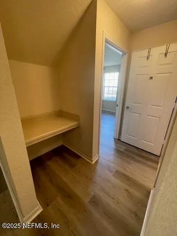 a view of utility room with wooden floor