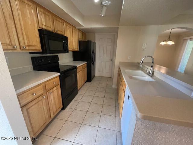 10075 Gate Parkway North, Unit 604 Jacksonville, FL 32246 - Photo 10 of 35 a kitchen with a sink a stove top oven and wooden floor