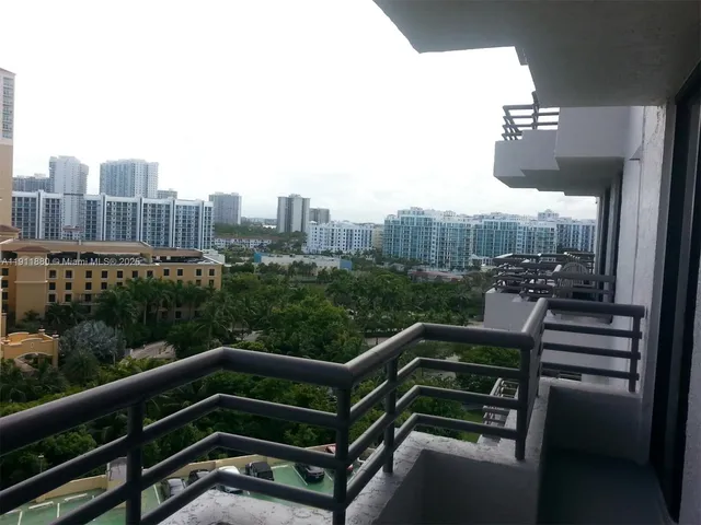 a view of a roof deck with wooden fence and bench