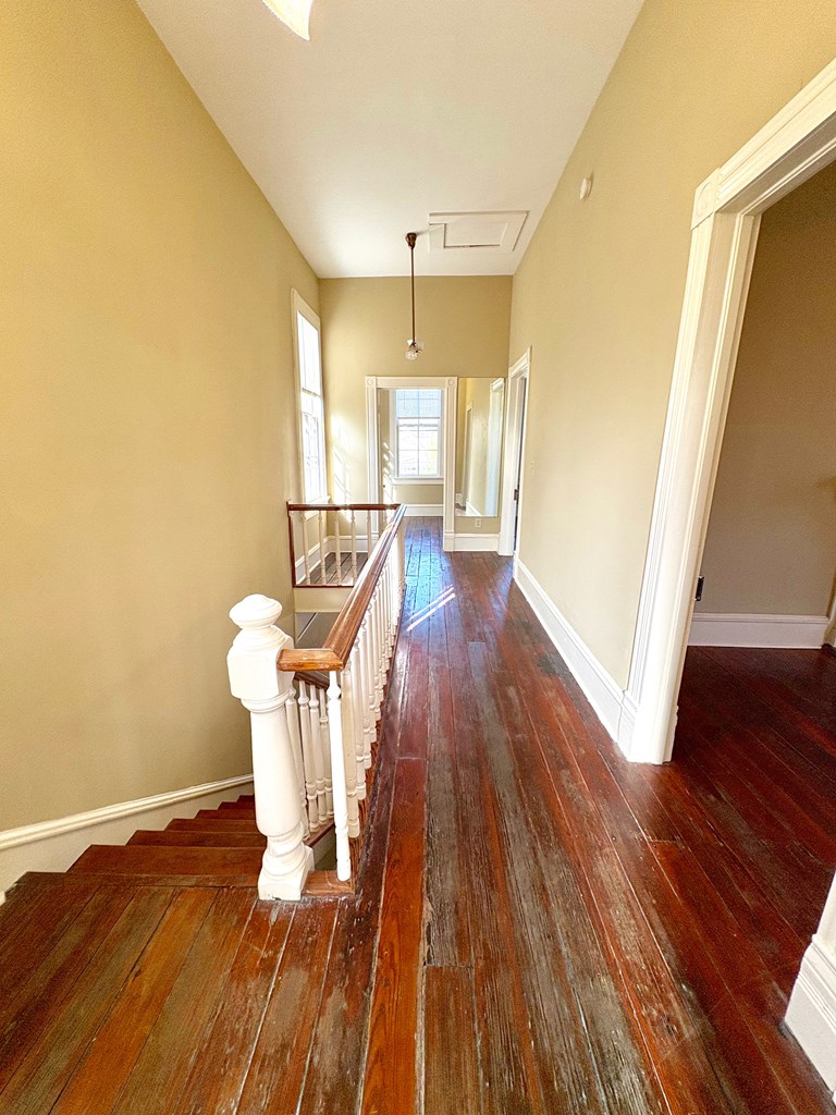 110 7th Street Columbus, GA 31901 - Photo 19 of 24 a view of a room with wooden floor table and chairs
