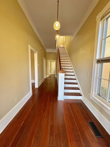 a view of entryway with wooden floor