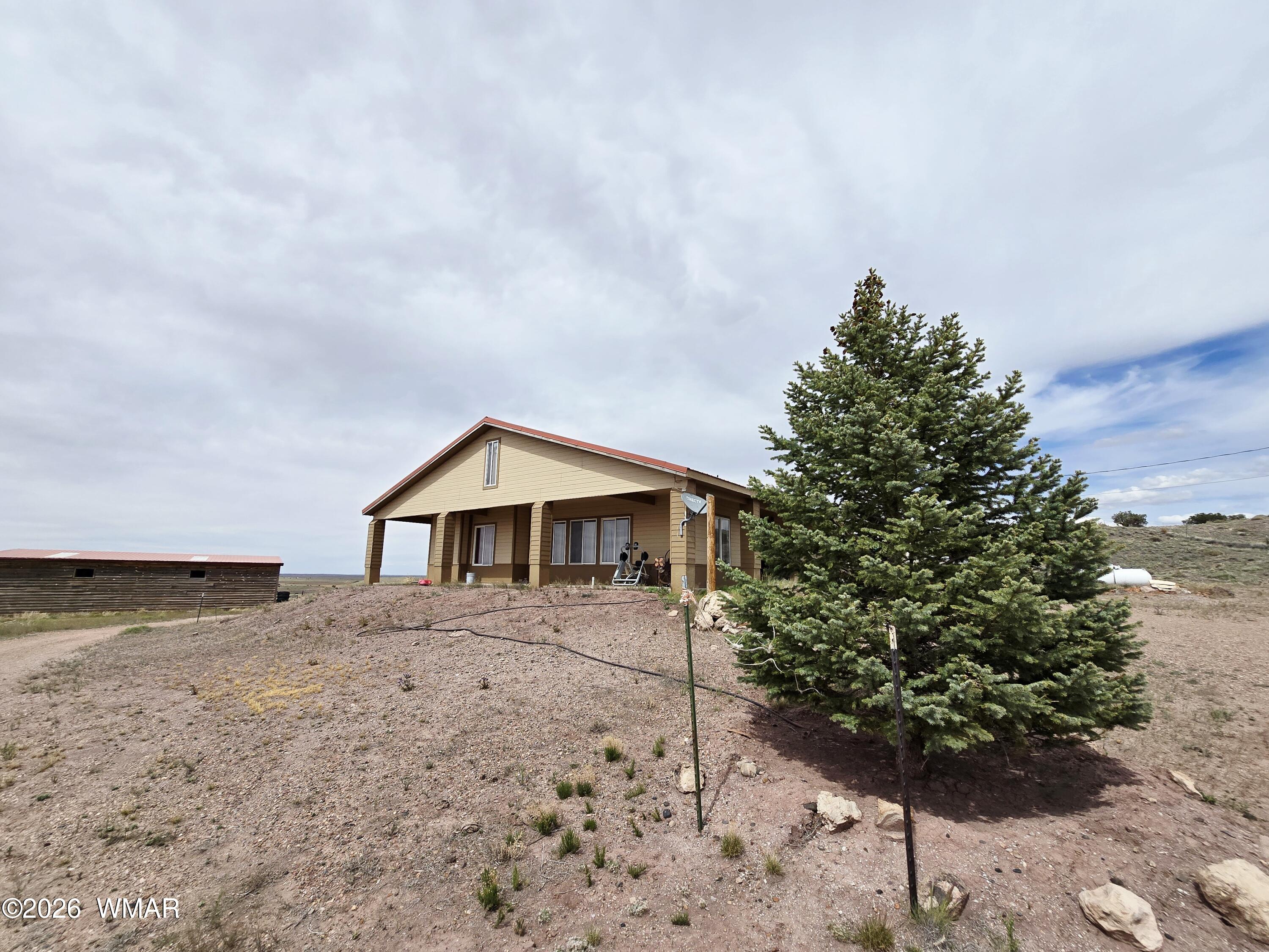 9046 Miller Trail Snowflake, AZ 85937 - Photo 33 of 34 a house with trees in front of it