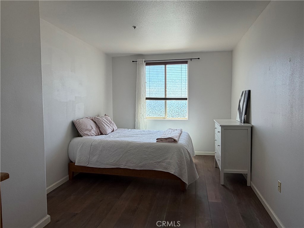 3740 Santa Rosalia Drive, Unit 425 Los Angeles, CA 90008 - Photo 11 of 24 a bedroom with a bed and a window