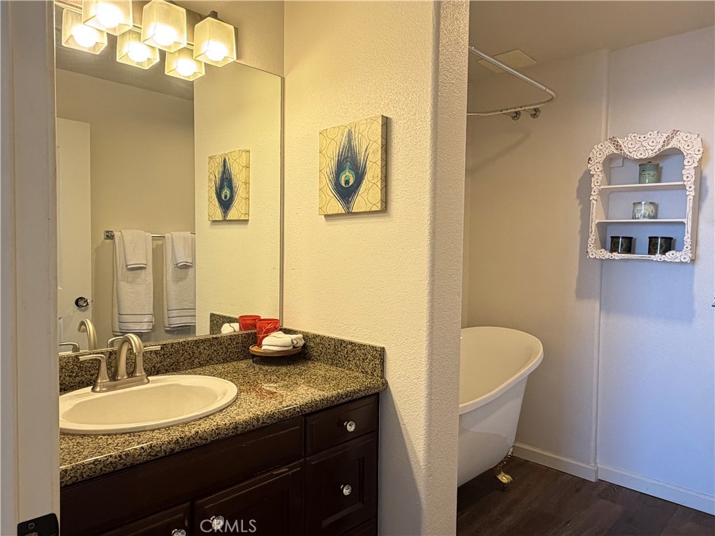 3740 Santa Rosalia Drive, Unit 425 Los Angeles, CA 90008 - Photo 14 of 24 a bathroom with a granite countertop sink and a mirror