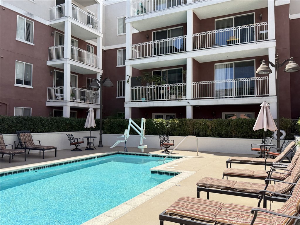 3740 Santa Rosalia Drive, Unit 425 Los Angeles, CA 90008 - Photo 19 of 24 a view of pool with outdoor seating