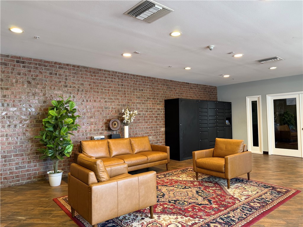 3740 Santa Rosalia Drive, Unit 425 Los Angeles, CA 90008 - Photo 2 of 24 a living room with furniture and a rug