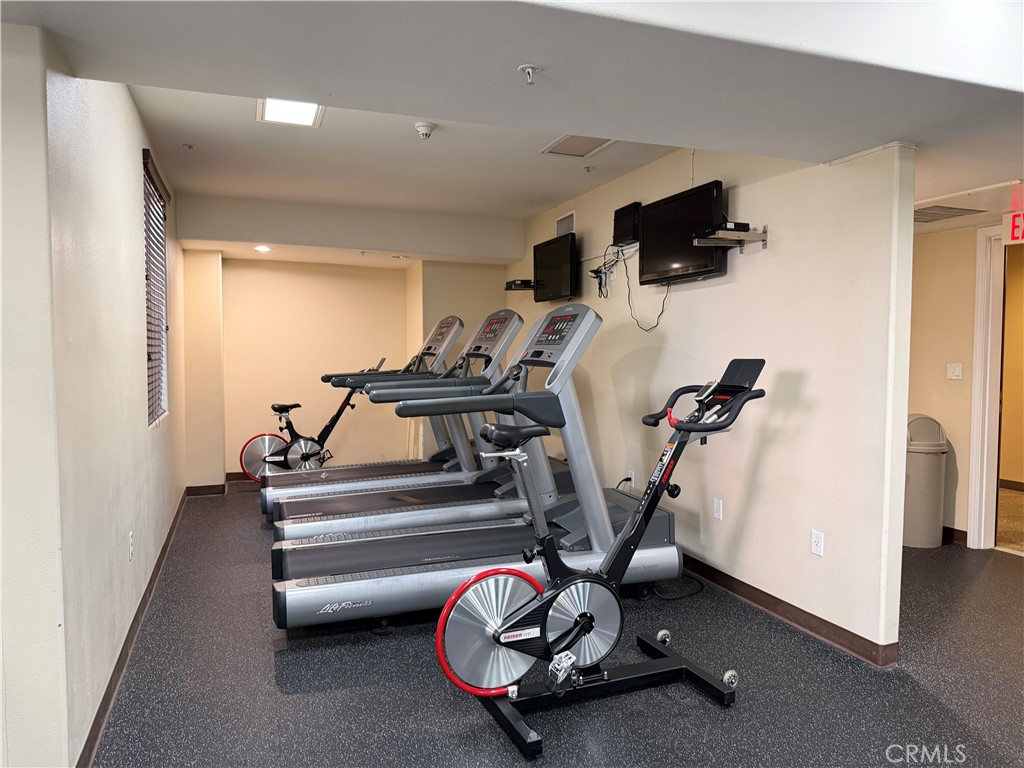 3740 Santa Rosalia Drive, Unit 425 Los Angeles, CA 90008 - Photo 23 of 24 a view of a room with gym equipment