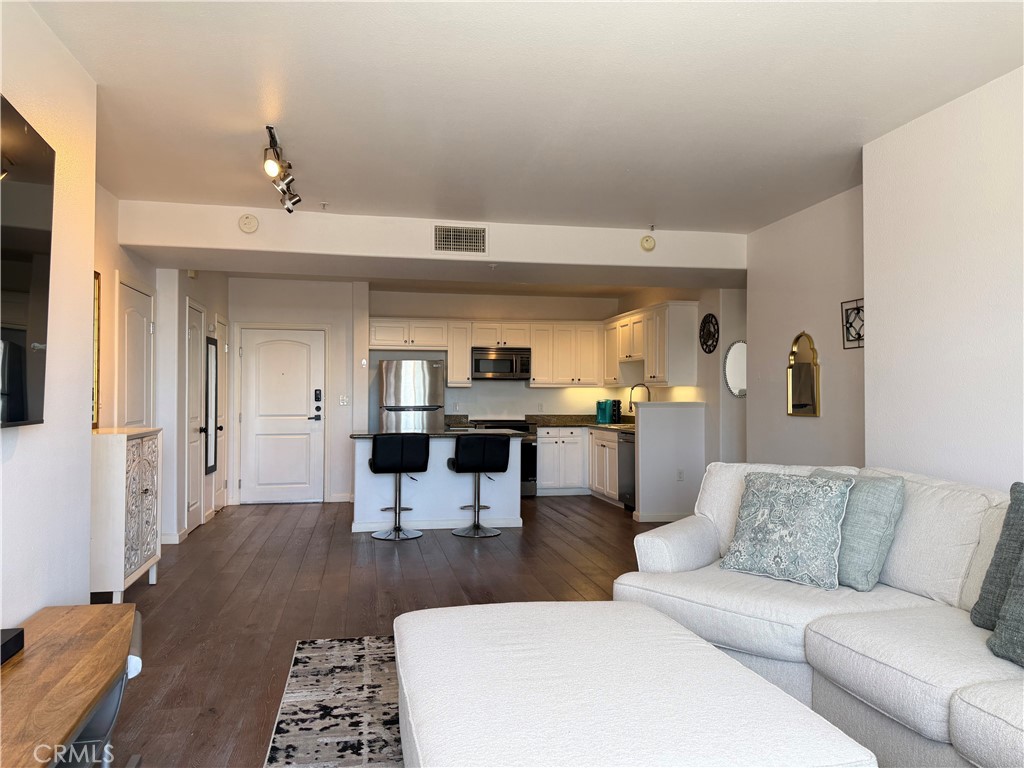 3740 Santa Rosalia Drive, Unit 425 Los Angeles, CA 90008 - Photo 6 of 24 a living room with furniture and view of kitchen