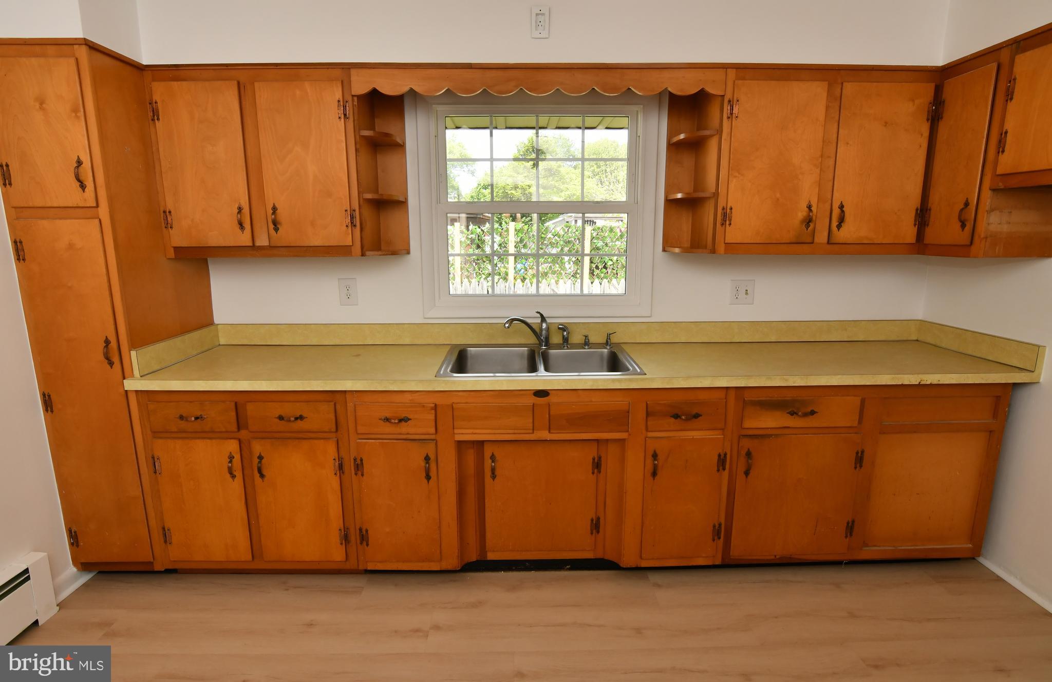 437 Beechcroft Road Winchester, VA 22601 - Photo 17 of 52 a kitchen with stainless steel appliances granite countertop a sink cabinets and a window