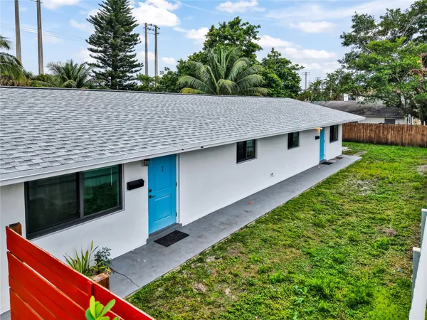 a aerial view of a house with a yard