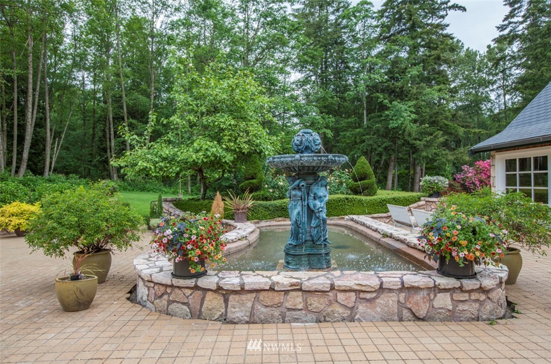 776 H Street Road Lynden, WA 98264 - Photo 21 of 25 a view of a house with a flower garden