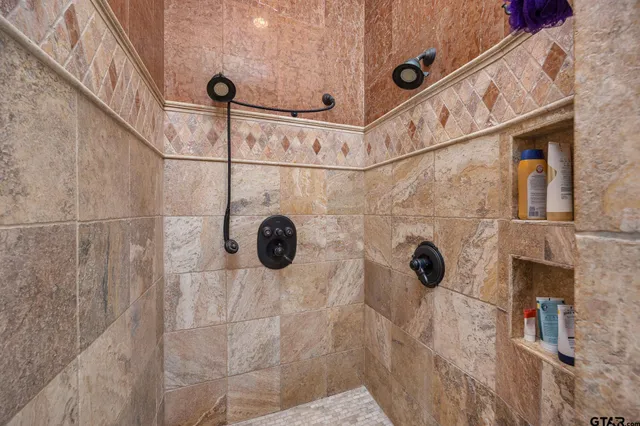 a living room with fireplace furniture and a flat screen tv