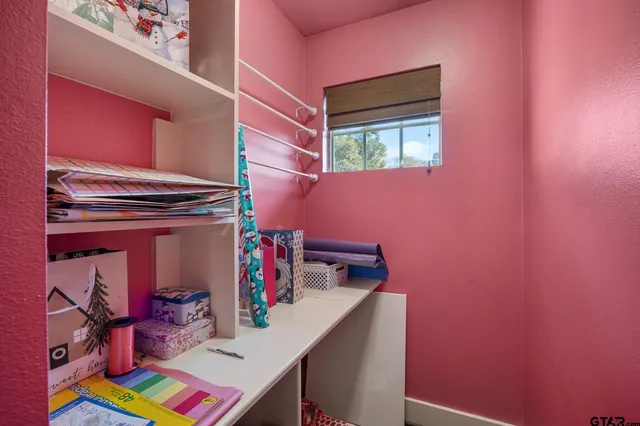a en suite bathroom with a double vanity sink a mirror and a bathtub