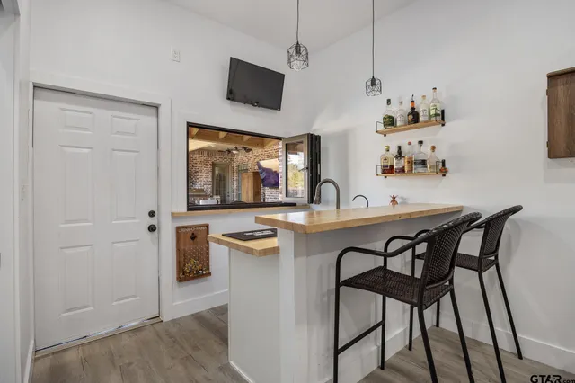 a bathroom with a bathtub and a window