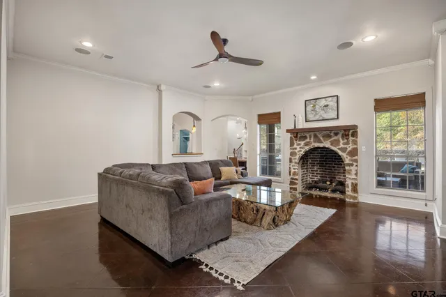 a living room with furniture and a fireplace
