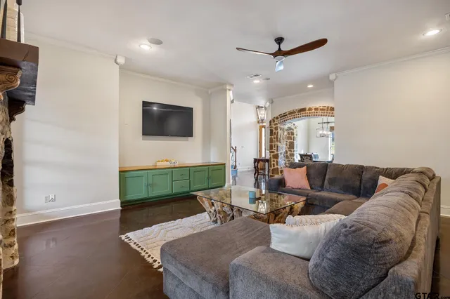 a living room with furniture and a flat screen tv