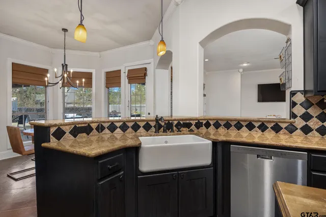 a kitchen with a stove and a sink