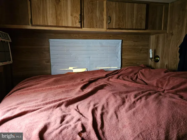 a bathroom with a toilet and shower