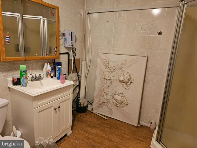 a bathroom with a shower and a sink