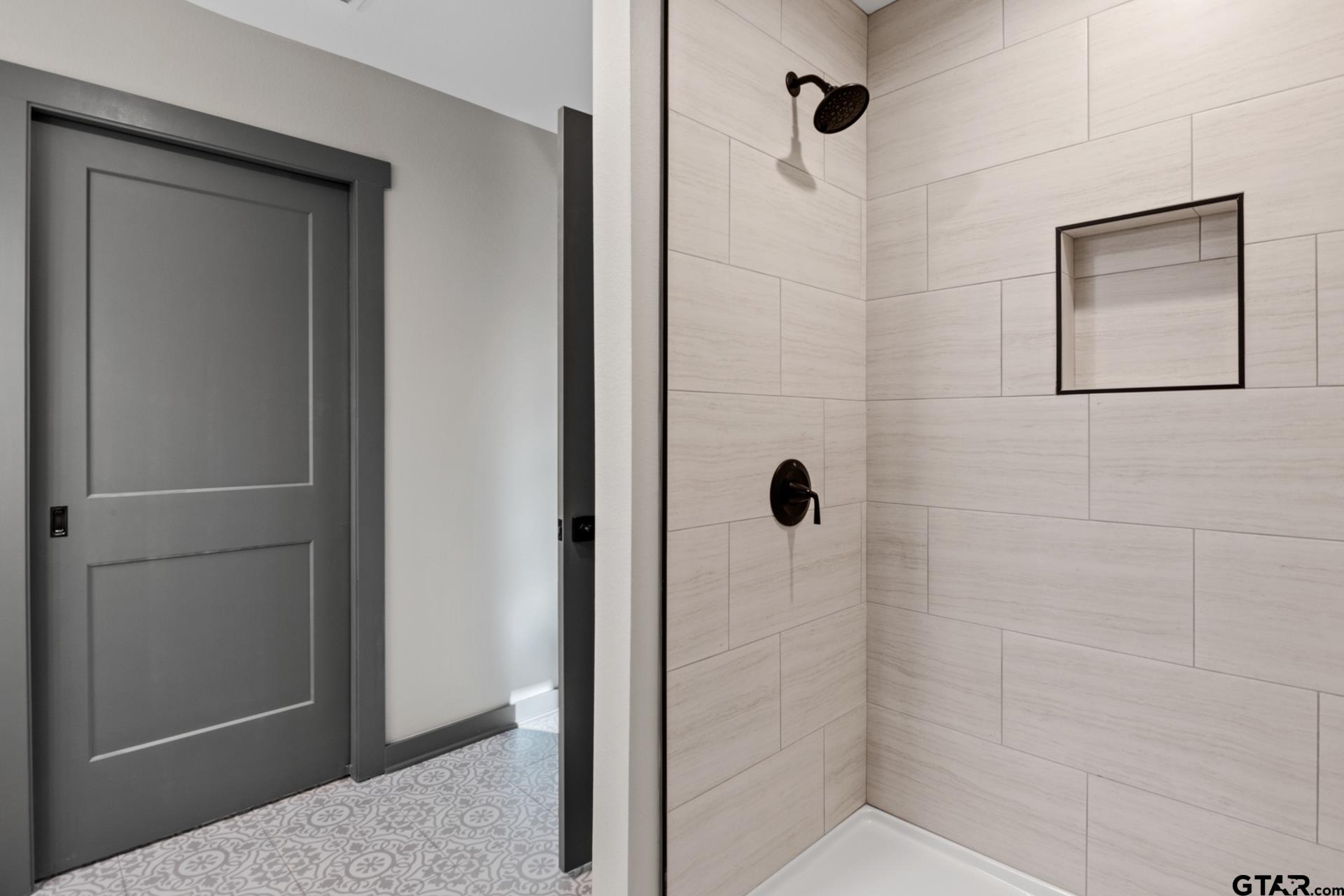 109 Yates Street Mount Vernon, TX 75457 - Photo 12 of 23 a bathroom with a shower