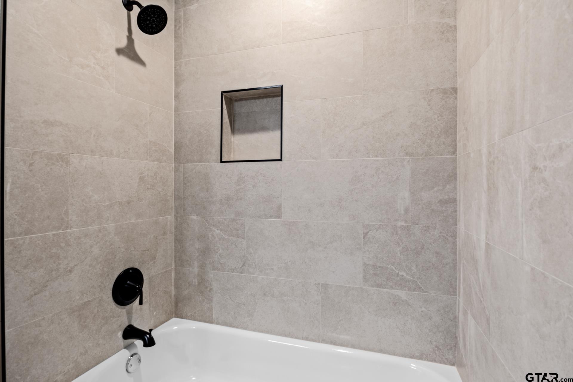 109 Yates Street Mount Vernon, TX 75457 - Photo 16 of 23 a bathroom with a shower