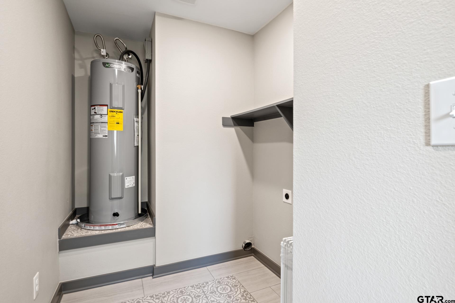 109 Yates Street Mount Vernon, TX 75457 - Photo 19 of 23 a bathroom with a sink and mirror