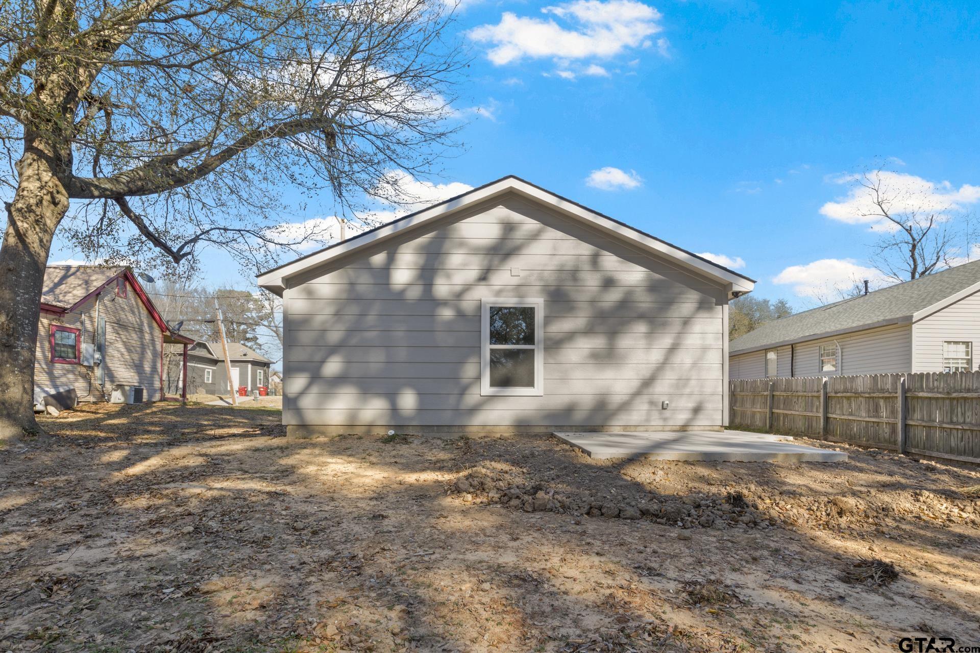 109 Yates Street Mount Vernon, TX 75457 - Photo 22 of 23 a view of backyard of house
