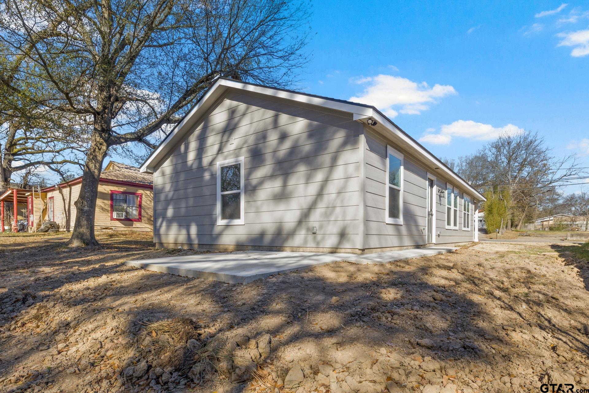 109 Yates Street Mount Vernon, TX 75457 - Photo 23 of 23 a view of a house with a yard