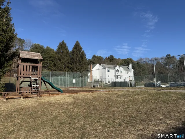 a view of a house with basketball court