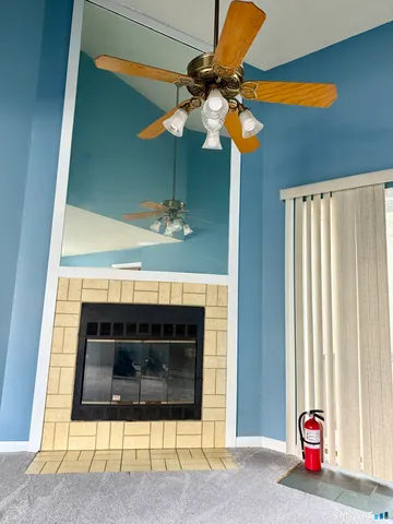 a view of fireplace and window