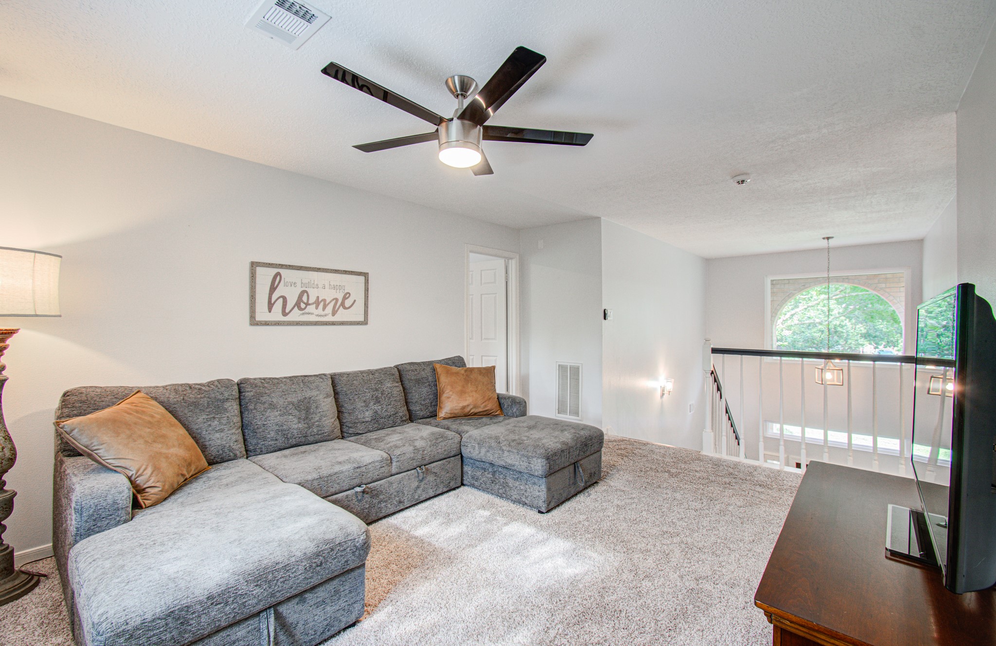 22927 Northoak Forest Lane Spring, TX 77389 - Photo 20 of 37 a living room with furniture and a large window