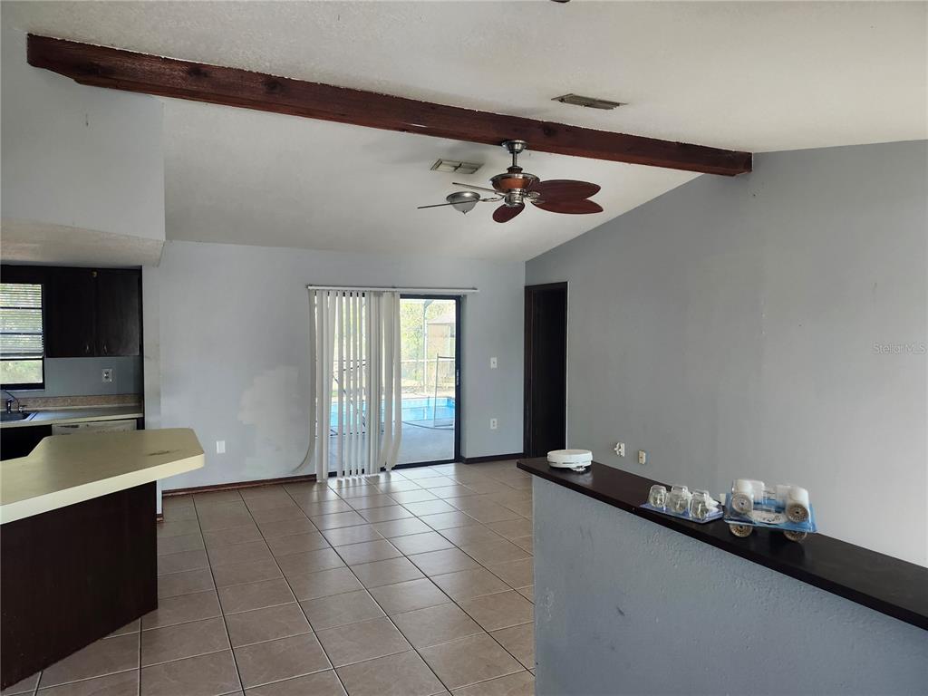 6141 Freeport Drive Spring Hill, FL 34606 - Photo 7 of 28 a view of a livingroom with a kitchen