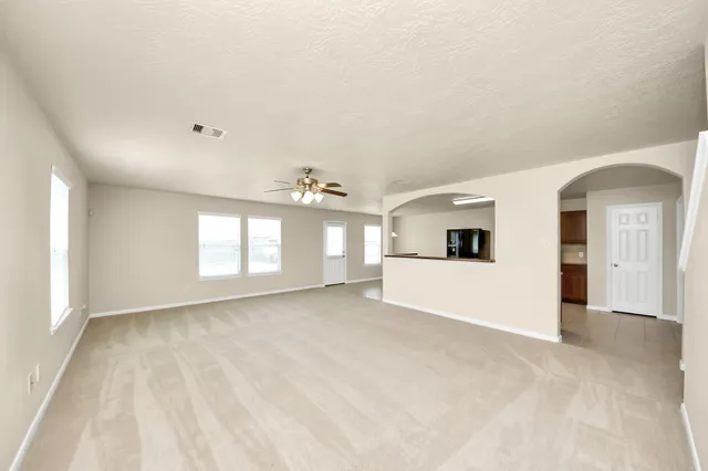 a view of a white house with a kitchen