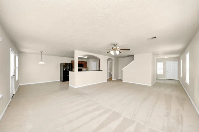 a view of empty room with windows