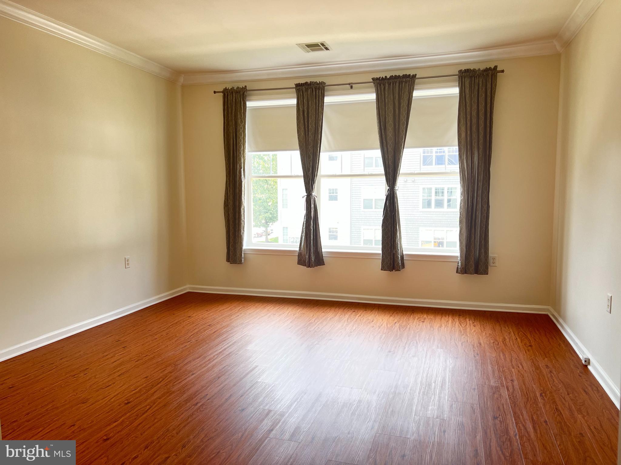 422 Masterson Court Ewing, NJ 08618 - Photo 15 of 29 an empty room with wooden floor and windows
