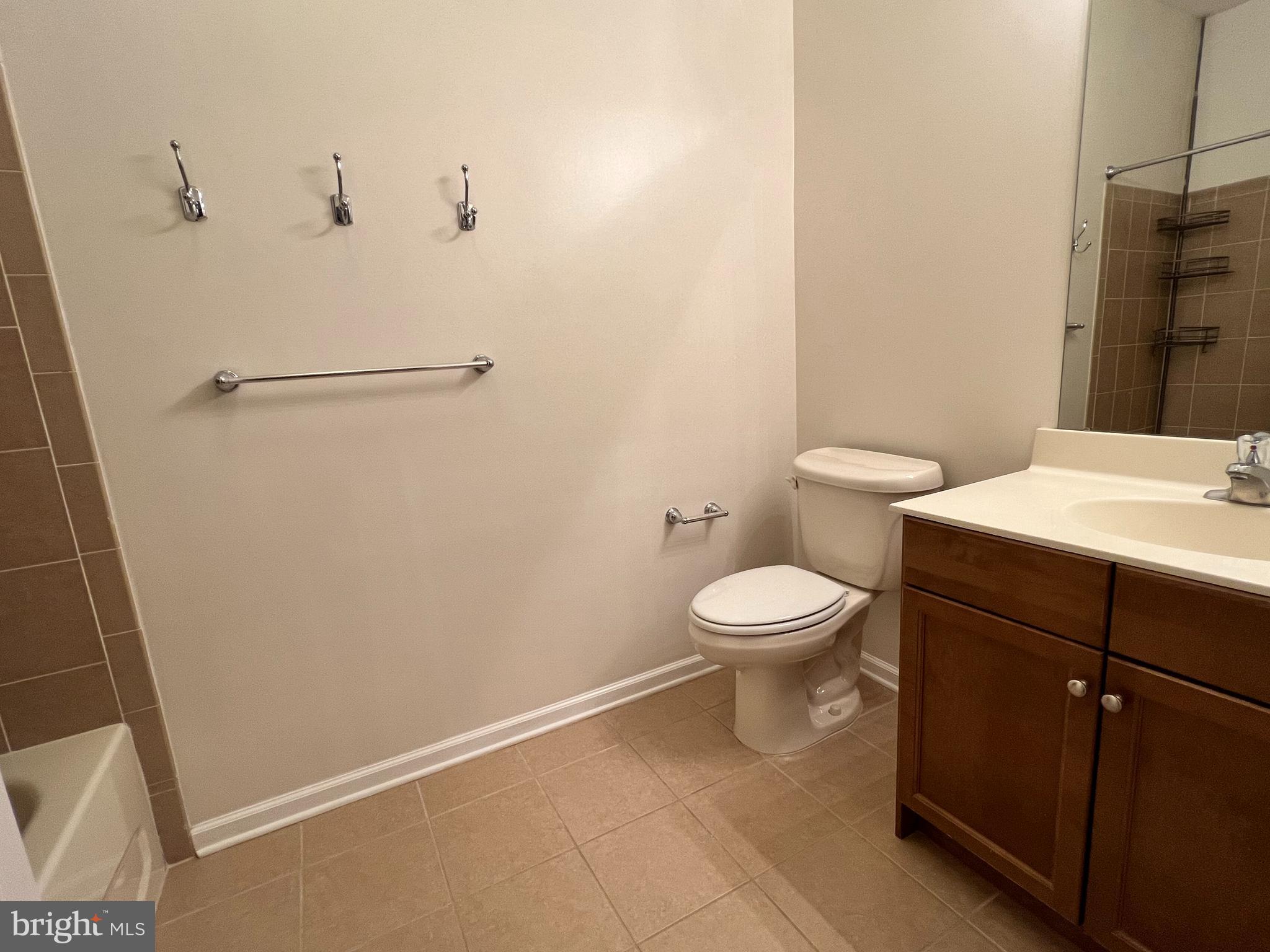 422 Masterson Court Ewing, NJ 08618 - Photo 20 of 29 a bathroom with a toilet a sink and a mirror
