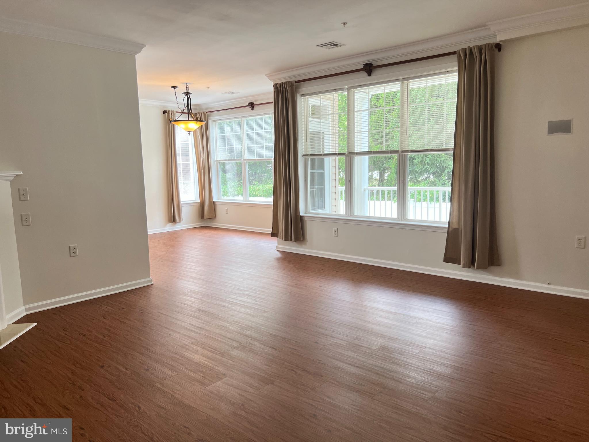 422 Masterson Court Ewing, NJ 08618 - Photo 8 of 29 an empty room with wooden floor and windows