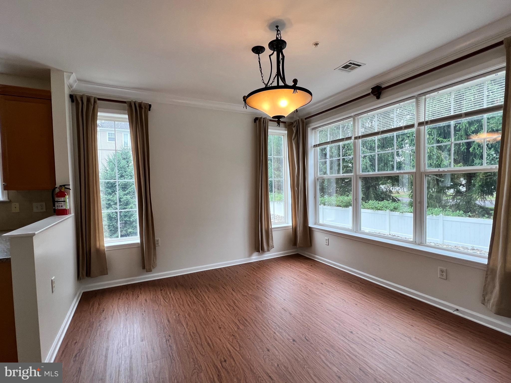 422 Masterson Court Ewing, NJ 08618 - Photo 9 of 29 a view of room with window and wooden floor