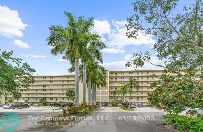 a view of a building and a yard