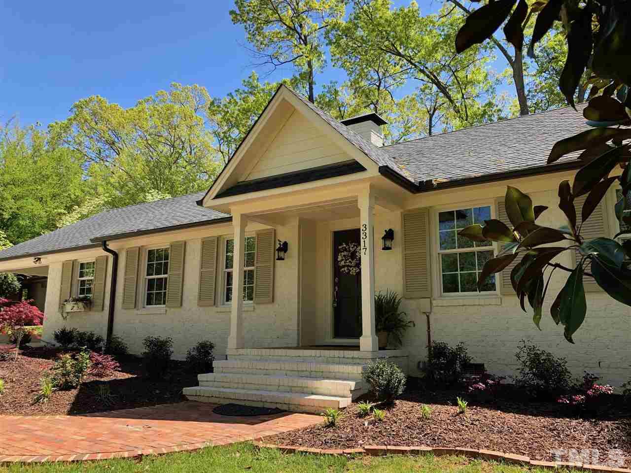 3317 Redbud Lane Raleigh, NC 27607 - Photo 1 of 25 a front view of a house with garden