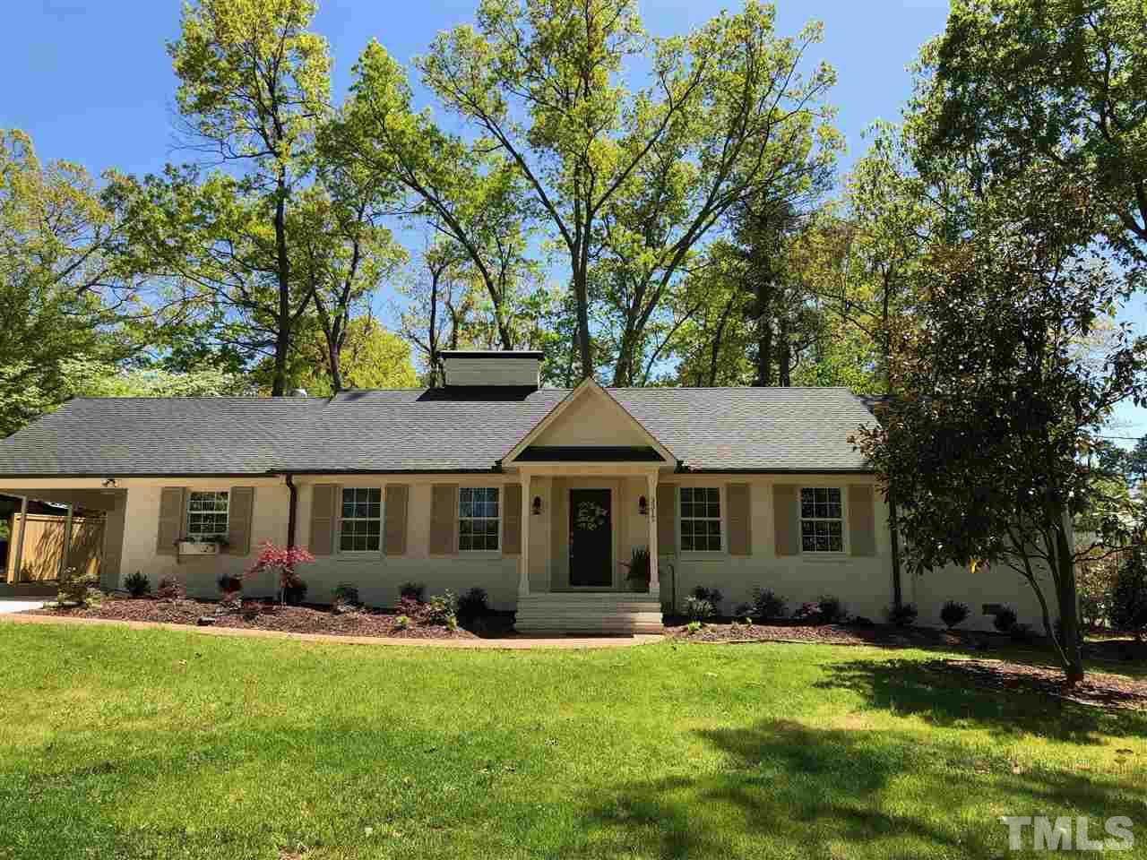 3317 Redbud Lane Raleigh, NC 27607 - Photo 2 of 25 a front view of a house with a garden