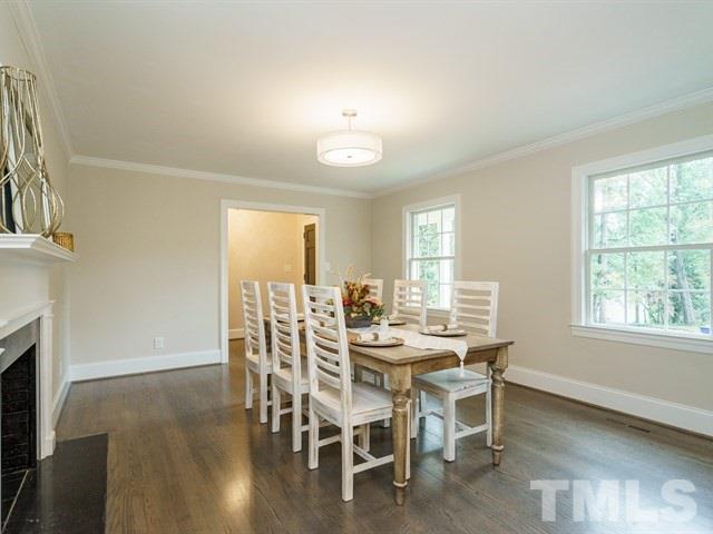 3317 Redbud Lane Raleigh, NC 27607 - Photo 3 of 25 a view of a dining room with furniture window and wooden floor