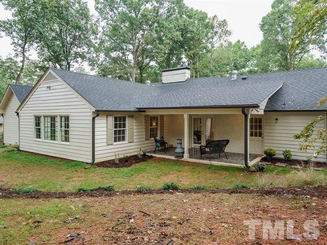 3317 Redbud Lane Raleigh, NC 27607 - Photo 25 of 25 a view of a house with backyard and trees in the background
