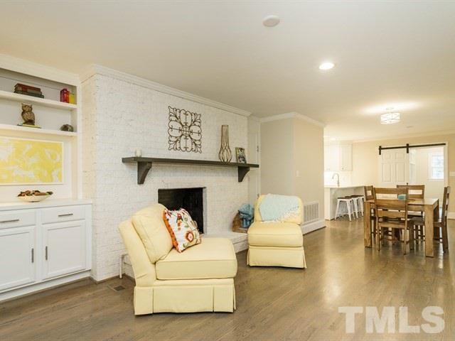3317 Redbud Lane Raleigh, NC 27607 - Photo 7 of 25 a living room with furniture and a table